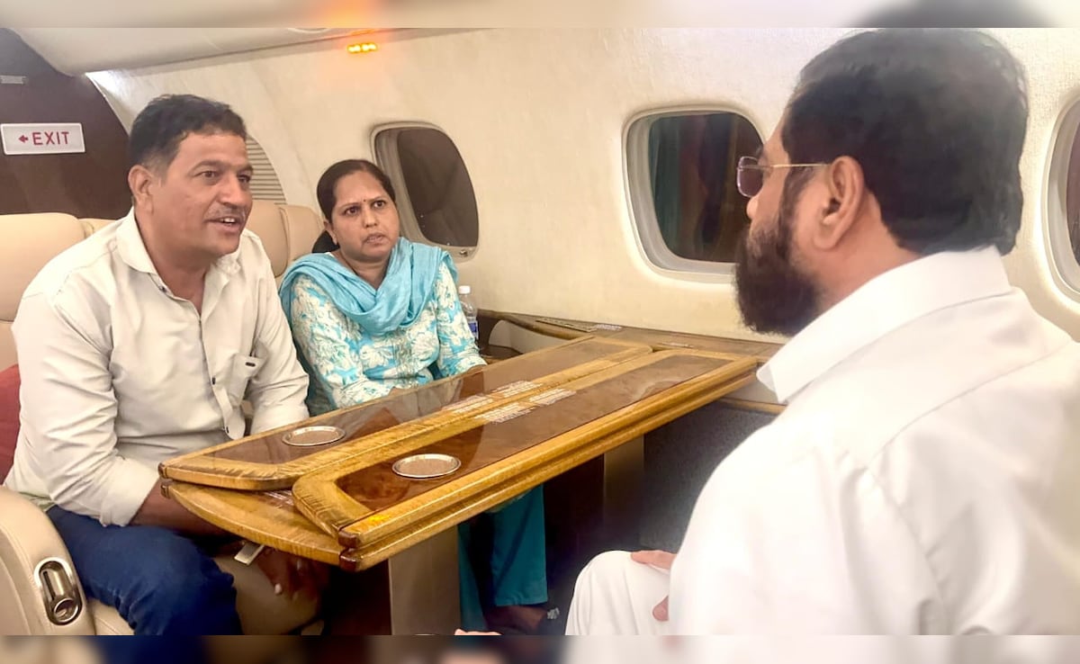 Eknath Shinde with the couple on his personal aircraft. Eknath Shinde with the couple on his personal aircraft.