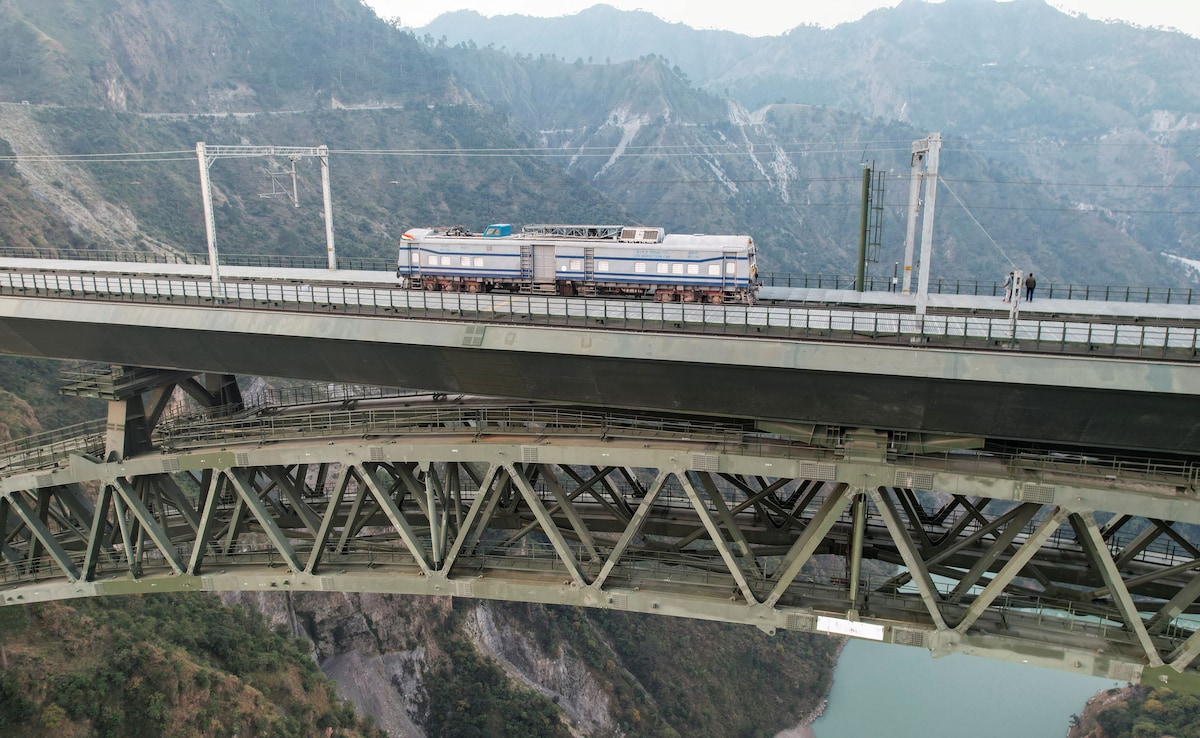 The Chenab Bridge is taller than the Eiffel Tower, reaching 1,178 feet above the riverbed, and its main arch has a length of 467 1,532 feet. The Chenab Bridge is taller than the Eiffel Tower, reaching 1,178 feet above the riverbed, and its main arch has a length of 467 1,532 feet.