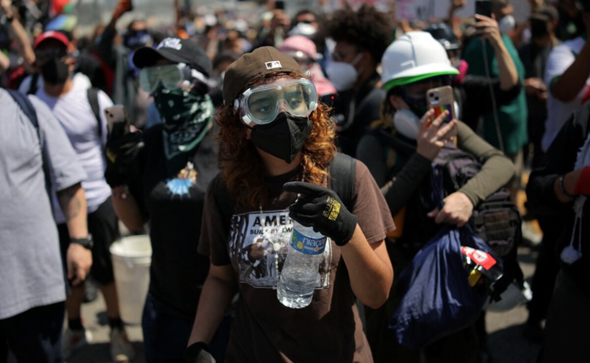 A demonstrator wears goggles and a face mask during a protest against federal immigration sweeps in downtown Los Angeles (Source: Reuters) A demonstrator wears goggles and a face mask during a protest against federal immigration sweeps in downtown Los Angeles (Source: Reuters)