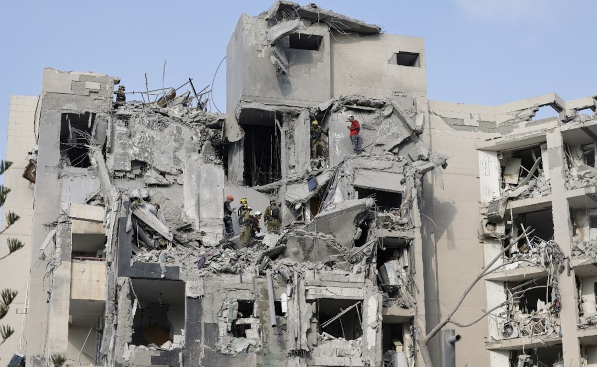 Remains of burnt cars and trees could be seen outside the building where the warhead had hit. 