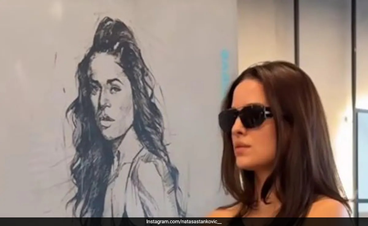 Natasa Stankovic's Balancing Pose On Stacked Weights Is As Difficult As It Looks
