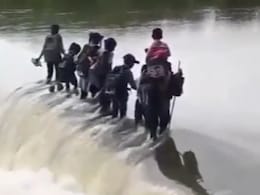 Video: With No Bridge, Children Cross Gushing River Daily To Attend School Video: With No Bridge, Children Cross Gushing River Daily To Attend School