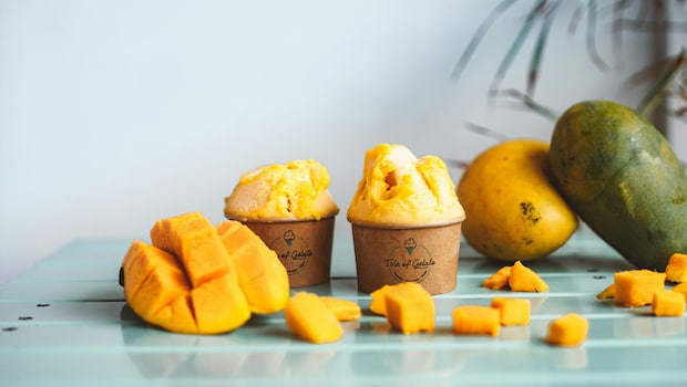 Frozen mango can be used in desserts and smoothies. Frozen mango can be used in desserts and smoothies.