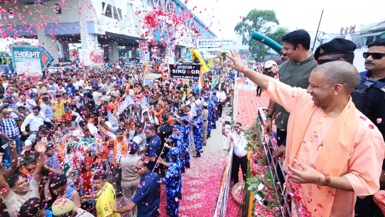 UP CM Yogi Adityanath Showers Flowers Petals On Kanwar Yatris In Meerut