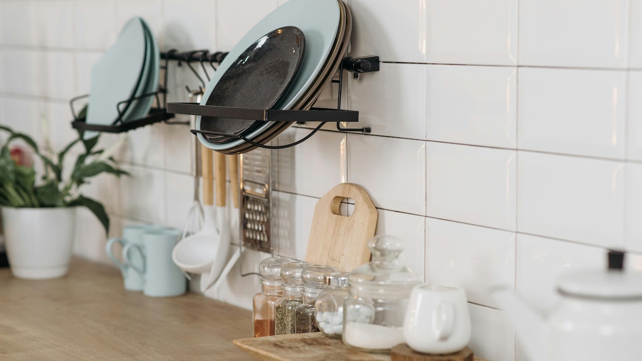 A shelf of essentials, a countertop full of kitchen essentials, this kitchen setup makes function look flawless.