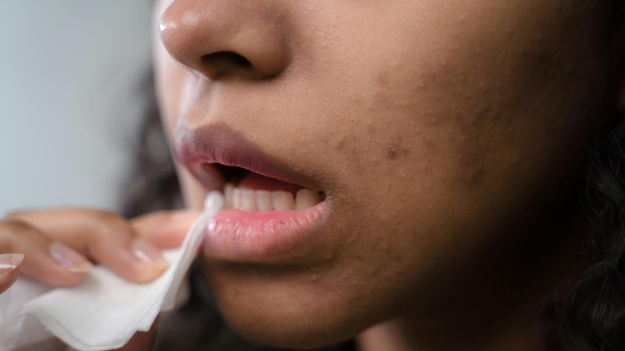Use a clean tissue to blot excess lip gloss and apply another light layer