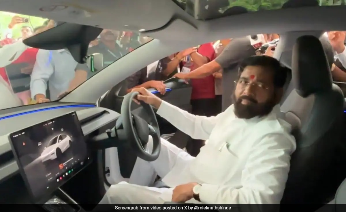 Watch: Eknath Shinde Drives Tesla Outside Vidhan Bhavan In Mumbai