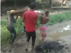 Pregnant Madhya Pradesh Woman Carried On Cot Due To Waterlogged Road
