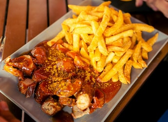 Currywurst: Germany's Popular Street Food Made With Sausage And Sauce Currywurst: Germany's Popular Street Food Made With Sausage And Sauce