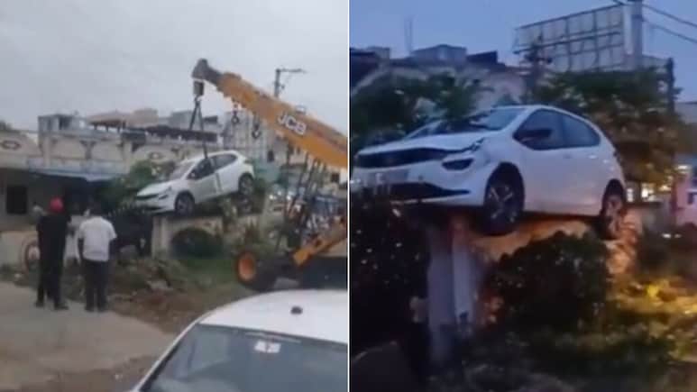 ड्राइवर ने नशे में ऐसे उड़ाई गाड़ी की घर की दीवार पर ही जा चढ़ी, उतारने के लिए आई JCB, यूजर बोले- खेल है क्या