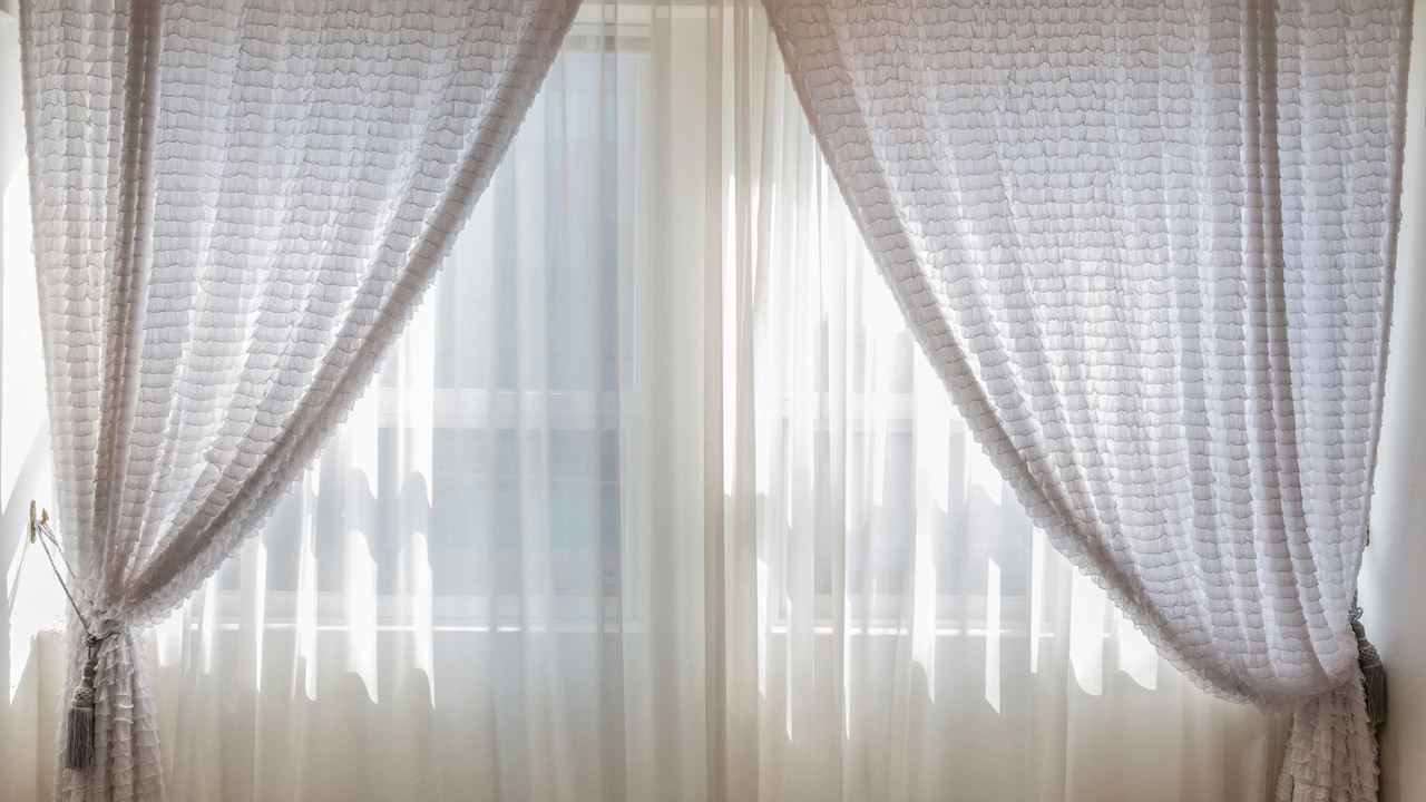 Light coloured curtians invite outside light into our homes and brighten up instantly