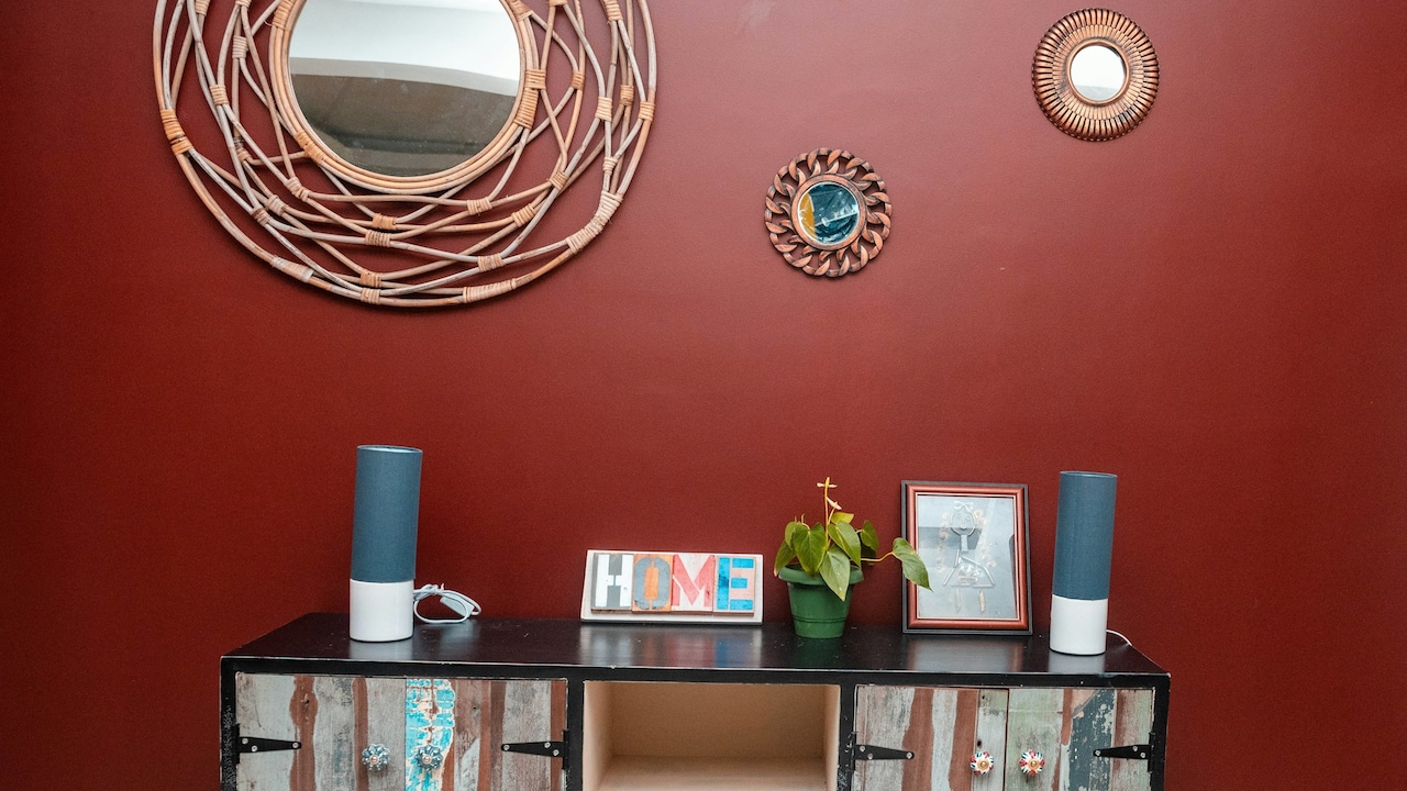 A mix of different mirrors offers a fun asymmetrical arrangement