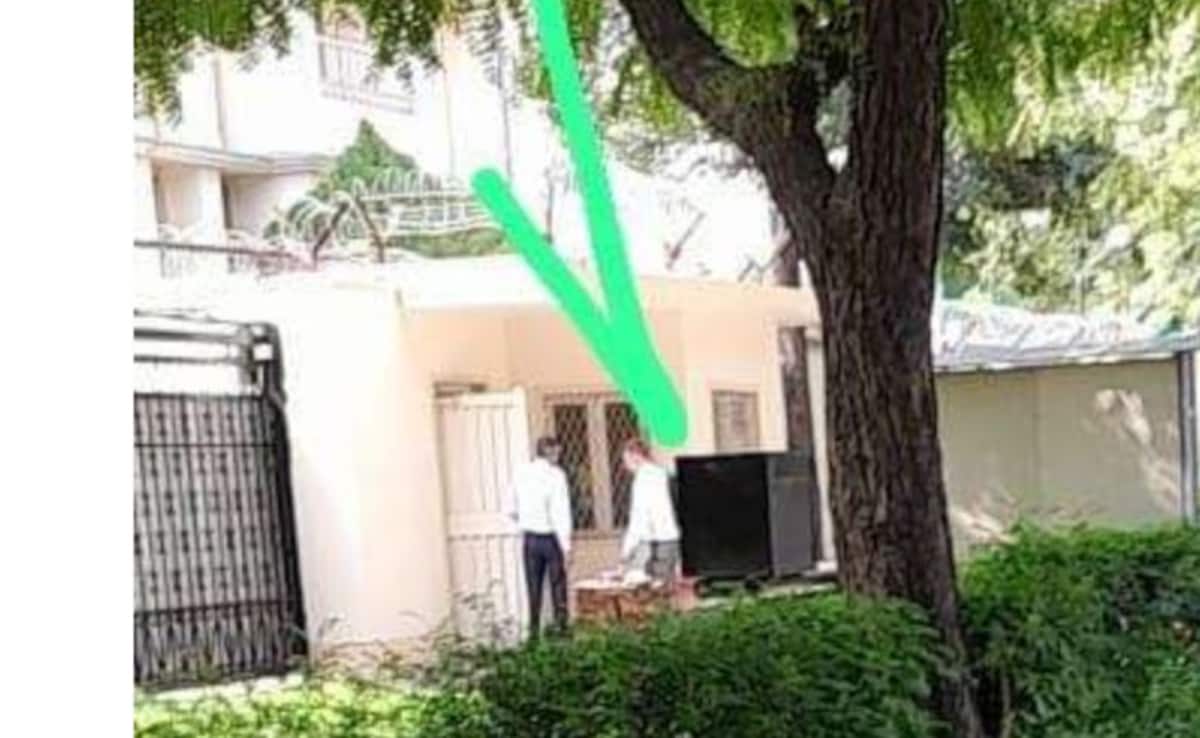 russian woman victoria basu entering russian embassy back gate