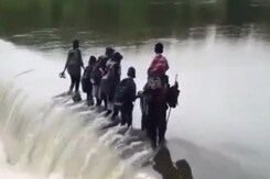 Video: With No Bridge, Children Cross Gushing River Daily To Attend School Video: With No Bridge, Children Cross Gushing River Daily To Attend School