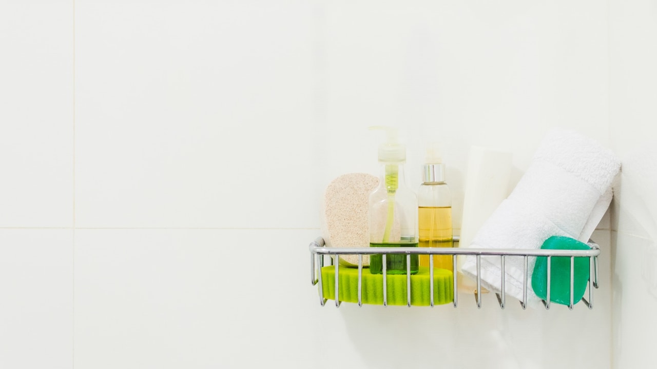 Declutter with ease using a bathroom rack that fits right in
