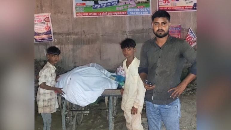 A Heart-Wrenching Image: 2 Children With Their Father's Body On Cart A Heart-Wrenching Image: 2 Children With Their Father's Body On Cart