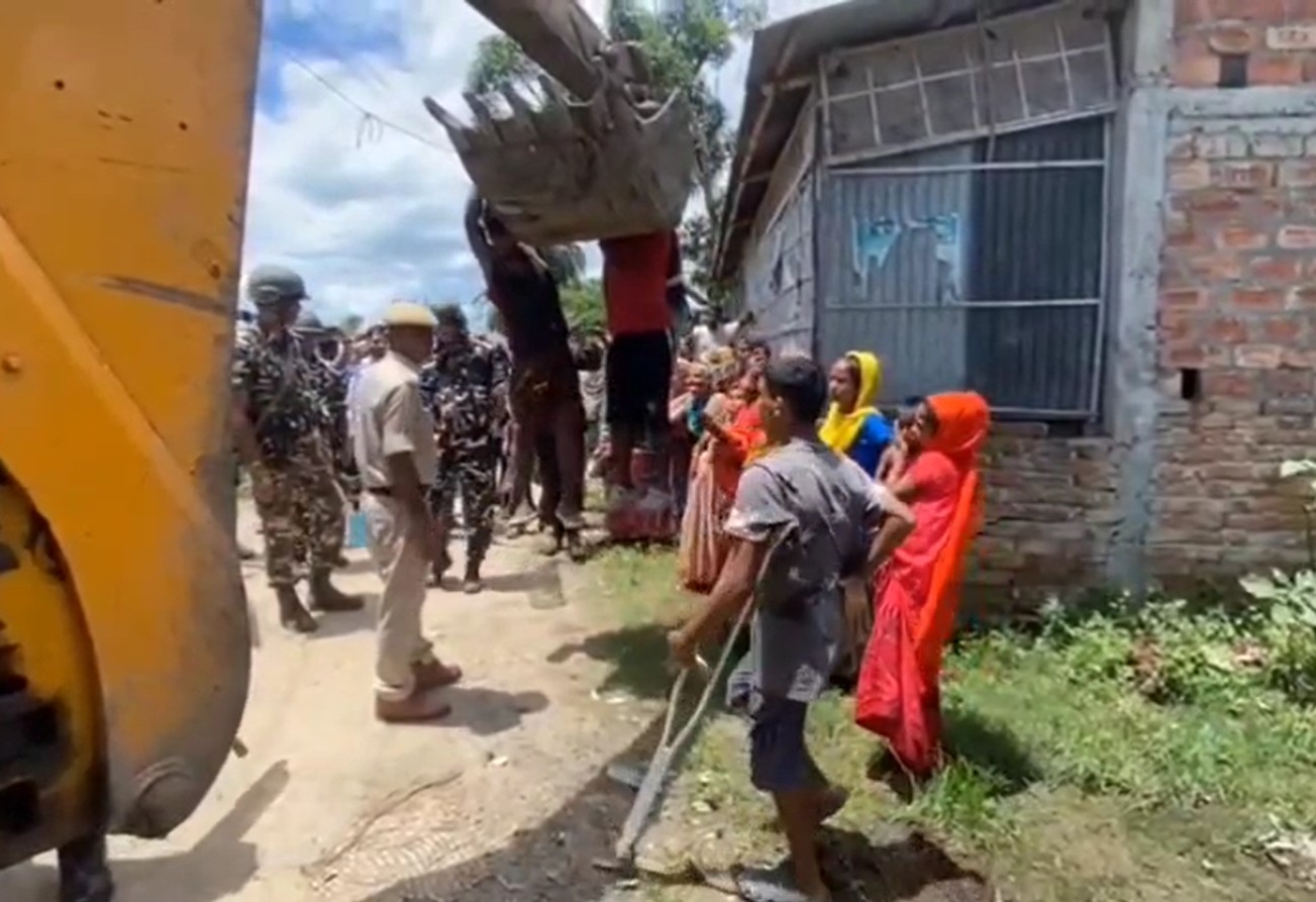 Video: 2 Men Hang Off Earthmover To Stop Eviction Drive In Assam
