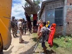 Video: 2 Men Hang Off Earthmover To Stop Eviction Drive In Assam