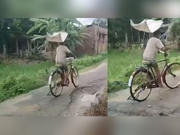 बारिश में बिना भीगे साइकिल चलाने के लिए लड़के ने लगाया ऐसा तगड़ा जुगाड़, क्रिएटिविटी पर फिदा हो गए लोग बारिश में बिना भीगे साइकिल चलाने के लिए लड़के ने लगाया ऐसा तगड़ा जुगाड़, क्रिएटिविटी पर फिदा हो गए लोग