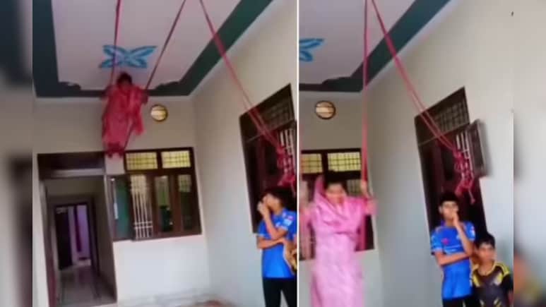 सावन में पेड़ के बजाय महिला का घर की छत पर झूला लगाने का अनोखा जुगाड़ वायरल, देख चौंके लोग सावन में पेड़ के बजाय महिला का घर की छत पर झूला लगाने का अनोखा जुगाड़ वायरल, देख चौंके लोग