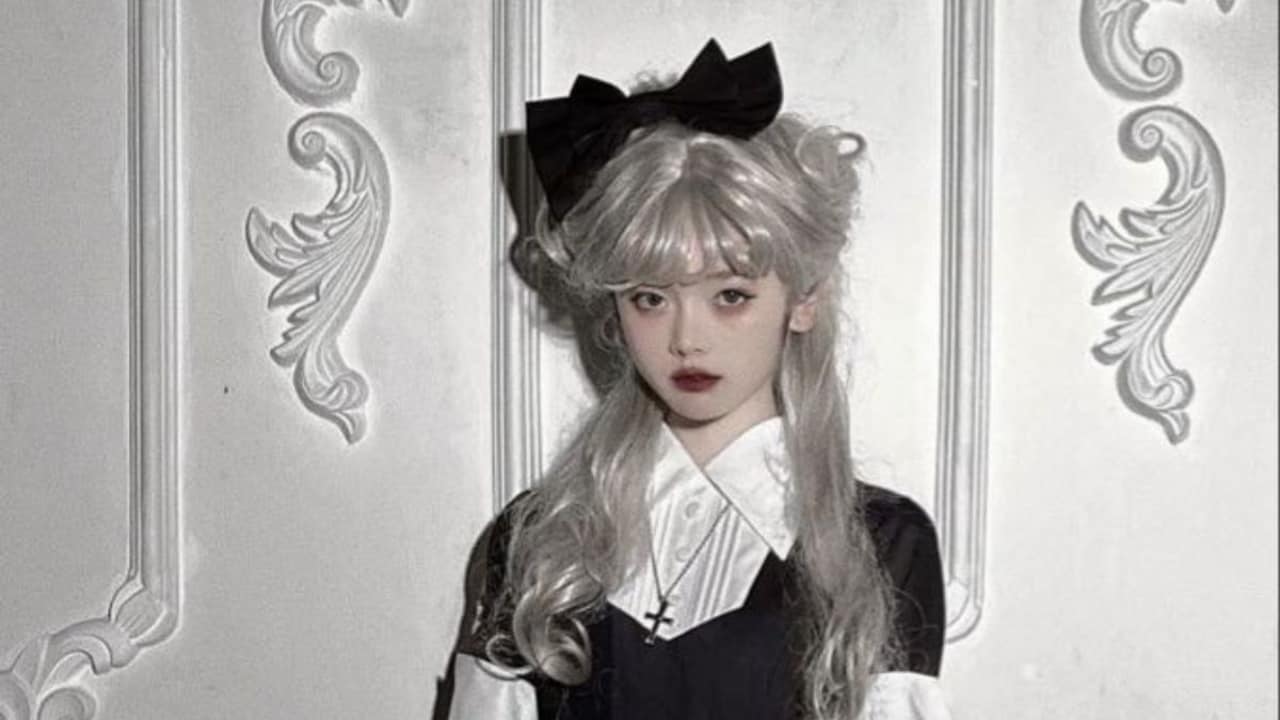Distressed fabrics and thrifted lace are key to the haunted doll look, blending eerie nostalgia with everyday wearability.