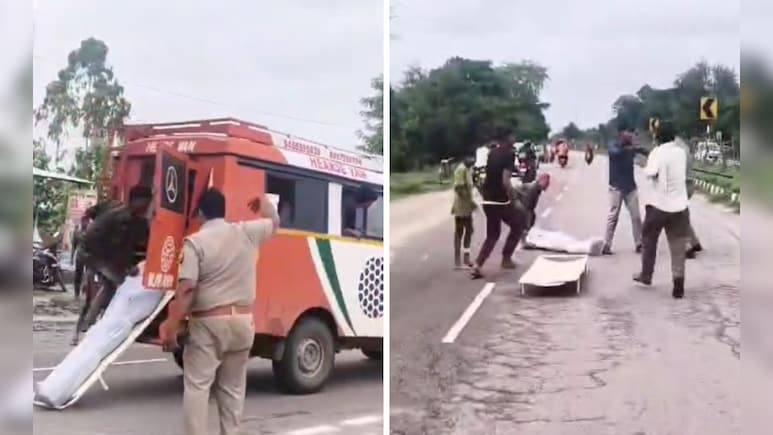 गोंडा में बीच सड़क एंबुलेंस से गिरा शव, इंसानियत को शर्मसार करने वाला वीडियो वायरल गोंडा में बीच सड़क एंबुलेंस से गिरा शव, इंसानियत को शर्मसार करने वाला वीडियो वायरल