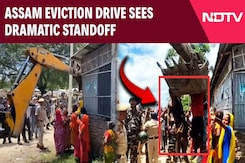 Assam News | Eviction Drive In Assam Turns Chaotic As Settler Clings To Bulldozer Assam News | Eviction Drive In Assam Turns Chaotic As Settler Clings To Bulldozer