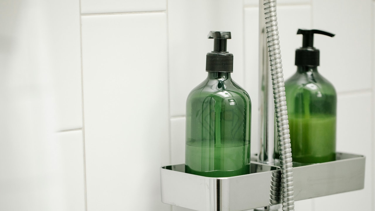 Use self-adhesive shelves to hold your toiletries