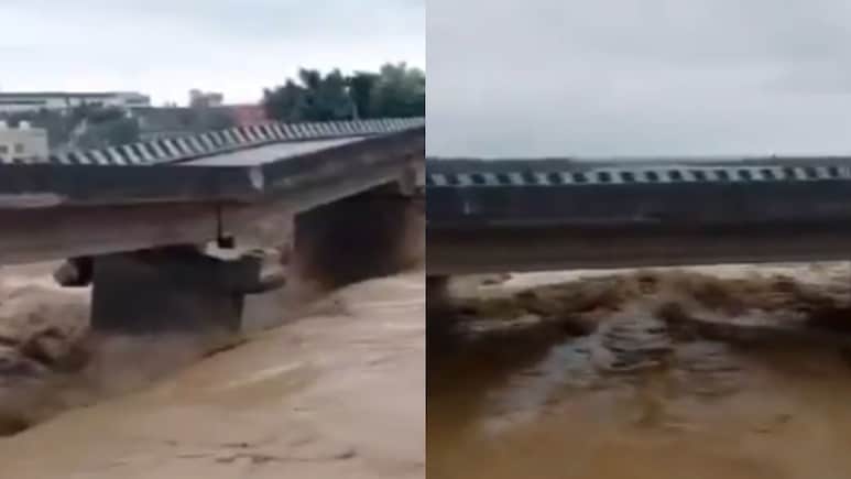 VIDEO: ये पुल तो टूटने वाला है... सैलाब से झुक गया ब्रिज, थम गईं यात्रियों की सांसें VIDEO: ये पुल तो टूटने वाला है... सैलाब से झुक गया ब्रिज, थम गईं यात्रियों की सांसें