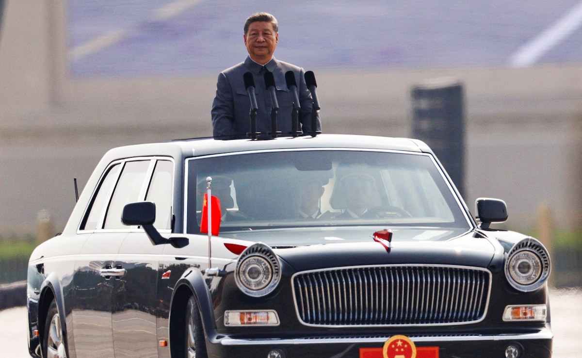 Chinese President Xi Jinping stands in a car to review the troops during a military parade to mark the 80th anniversary of the end of World War Two Chinese President Xi Jinping stands in a car to review the troops during a military parade to mark the 80th anniversary of the end of World War Two