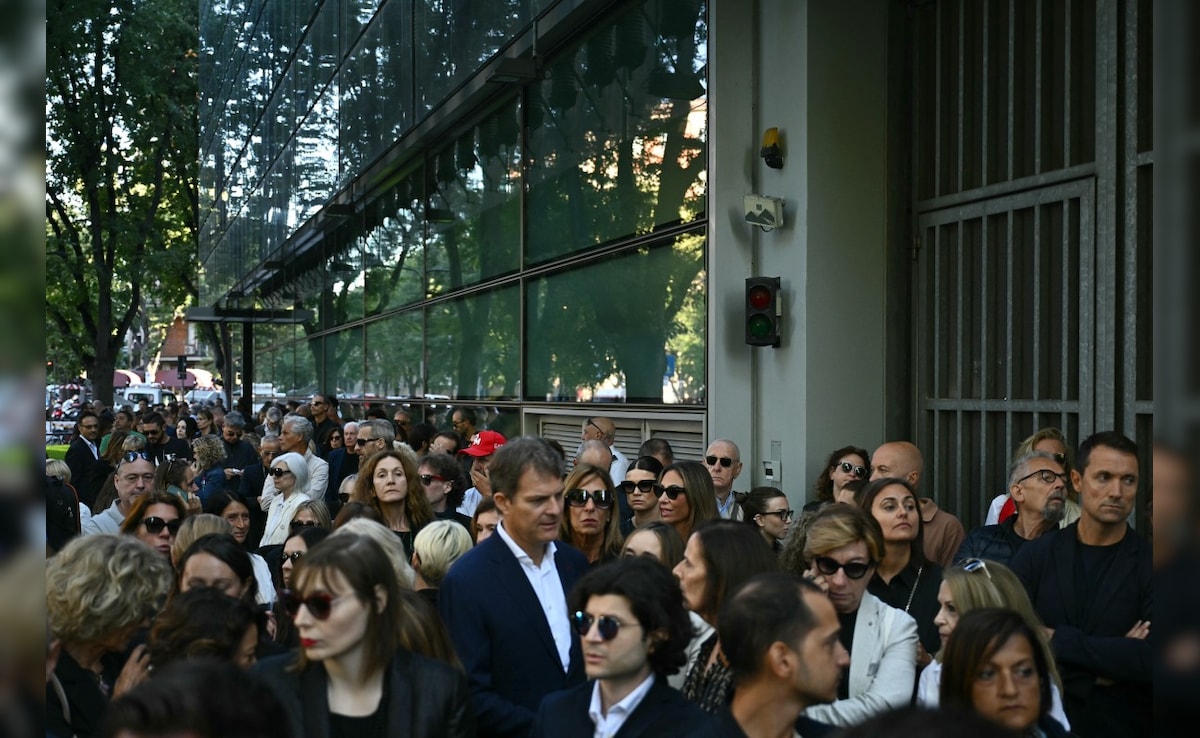 Hundreds of people attend Armanis funeral. Photo: AFP Hundreds of people attend Armanis funeral. Photo: AFP