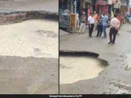 Road Caves In Due To Heavy Rainfall In Delhi's Janakpuri Road Caves In Due To Heavy Rainfall In Delhi's Janakpuri