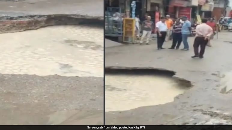 Road Caves In Due To Heavy Rainfall In Delhi's Janakpuri Road Caves In Due To Heavy Rainfall In Delhi's Janakpuri