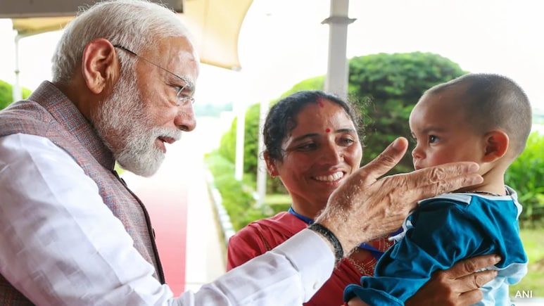 PM Modi Meets Family's Lone Cloudburst Survivor In Himachal Pradesh PM Modi Meets Family's Lone Cloudburst Survivor In Himachal Pradesh