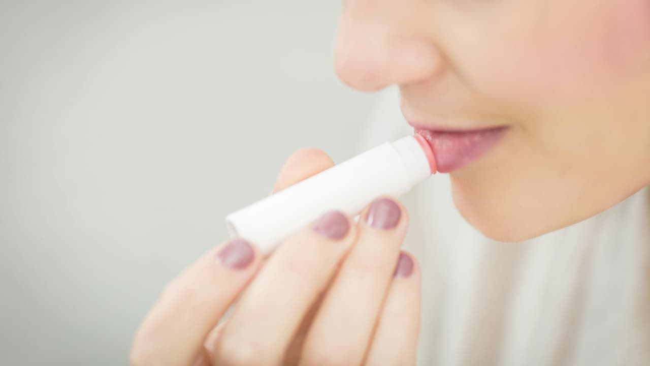 A tinted lip balm can prevent chapped lips and keep them moisturised all day long