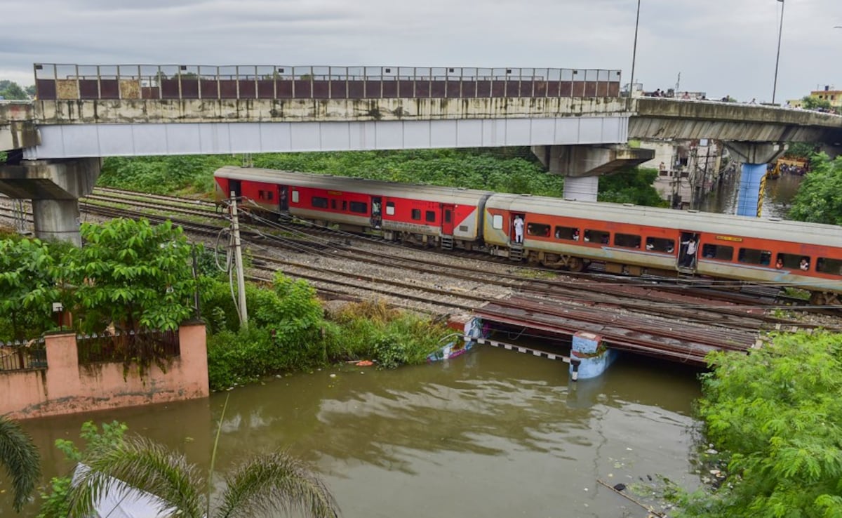 A train passes above a flooded underpass after heavy rainfall, in Jalandhar, Punjab (PTI) A train passes above a flooded underpass after heavy rainfall, in Jalandhar, Punjab (PTI)