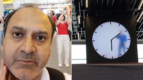 घड़ी के अंदर इंसान… एम्स्टर्डम एयरपोर्ट की अनोखी Human Watch देख चौंके भारतीय पर्यटक, बोले- ये थकता नहीं क्या