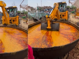"Oil Grease With Gravy Is Free": JCB Used For Stirring Dal Makhani Left Foodies Intrigued "Oil Grease With Gravy Is Free": JCB Used For Stirring Dal Makhani Left Foodies Intrigued