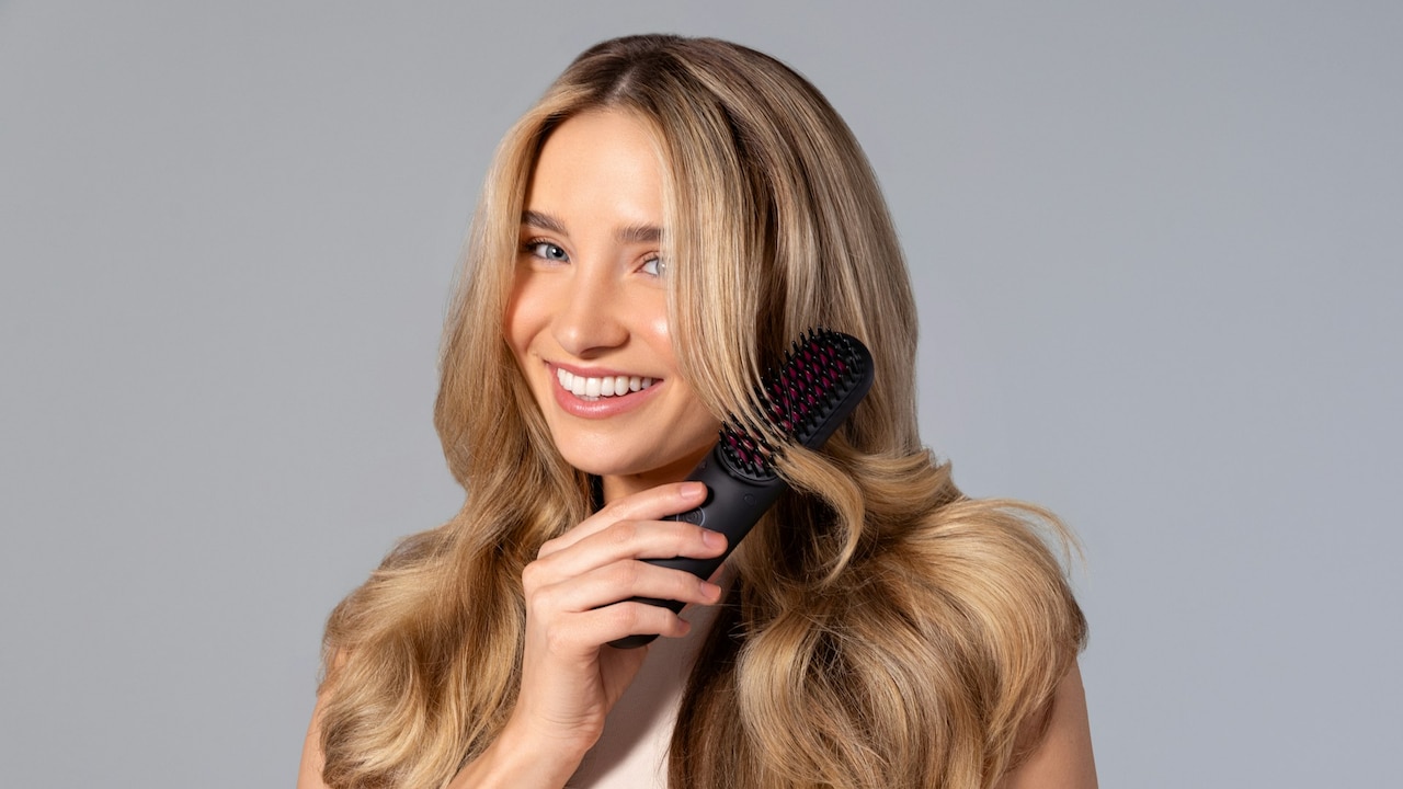 A mini brush takes less space in the bag and helps tame flyaways or tangled knots