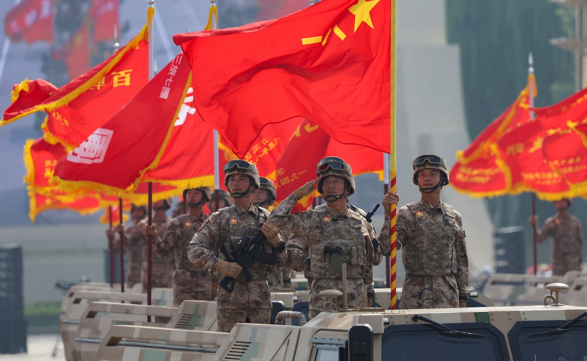 Flags flutter during a military parade to mark the 80th anniversary of the end of World War Two, in Beijing. Flags flutter during a military parade to mark the 80th anniversary of the end of World War Two, in Beijing.