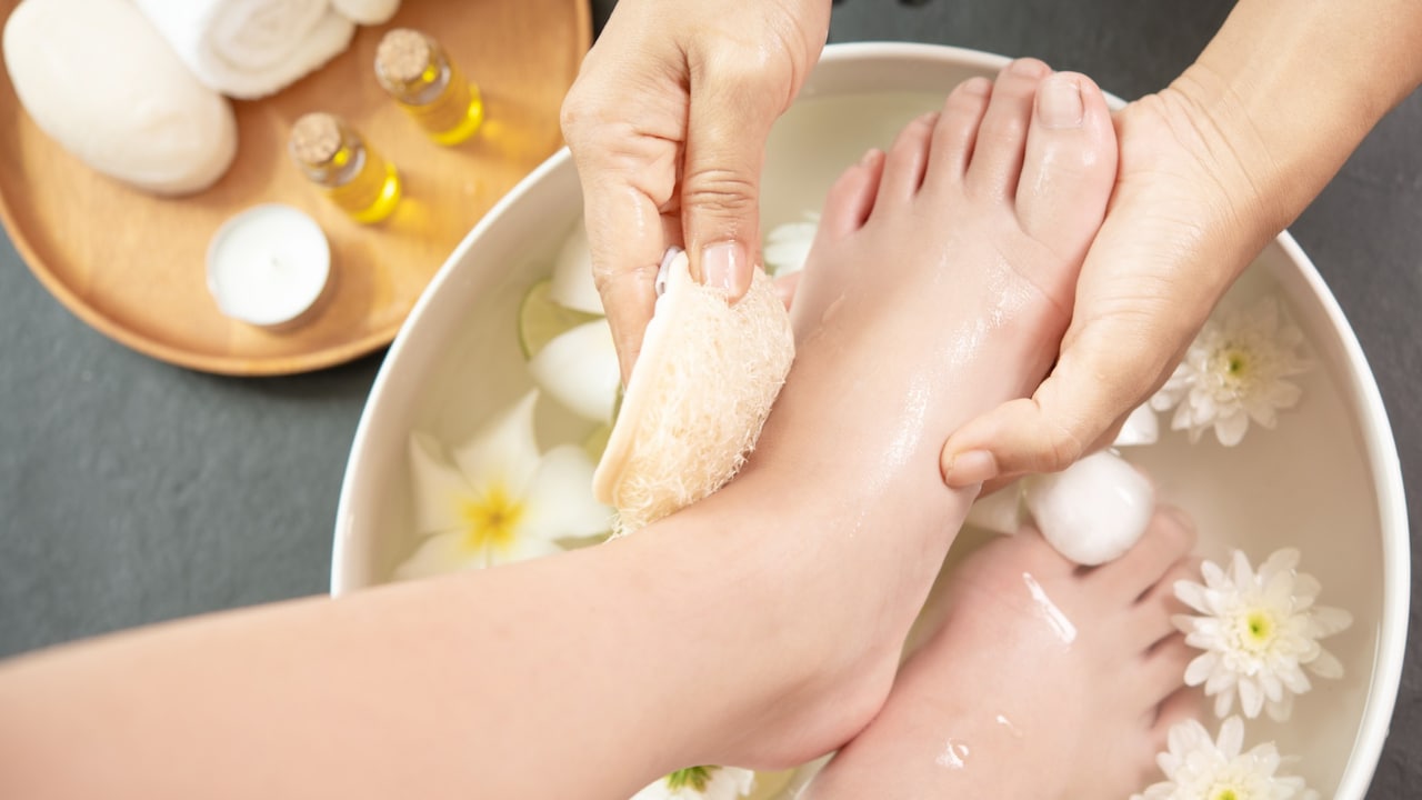 Use a pumice stone or heel filer to remove loose, dead skin cells