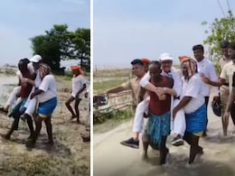 "Unwell" Congress MP Tariq Anwar Carried By Villagers For Flood Inspection In Bihar "Unwell" Congress MP Tariq Anwar Carried By Villagers For Flood Inspection In Bihar