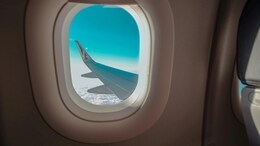 Why Do Airplane Windows Have Tiny Holes? 5 Key Reasons