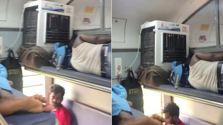 ट्रेन की बर्थ पर ही कूलर लगाकर सो गया शख्स, वायरल Video देख दंग रह गए लोग, बोले- जनरल में 1 AC का मज़ा ट्रेन की बर्थ पर ही कूलर लगाकर सो गया शख्स, वायरल Video देख दंग रह गए लोग, बोले- जनरल में 1 AC का मज़ा