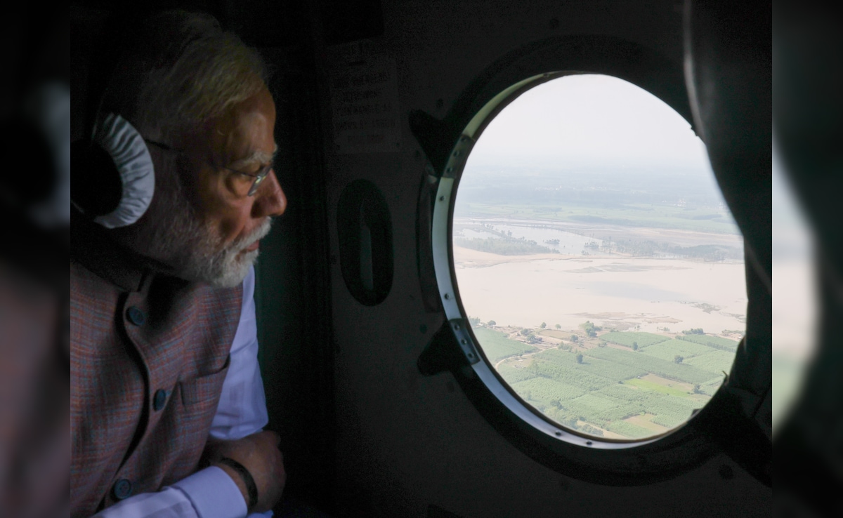 PM Modi conducts aerial survey of flood-hit areas in Punjab. PM Modi conducts aerial survey of flood-hit areas in Punjab.