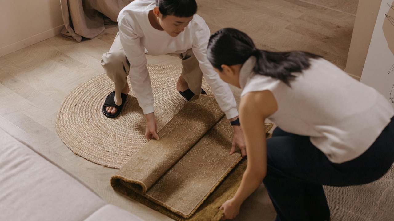 Heres how you can layer rugs in your space the right way