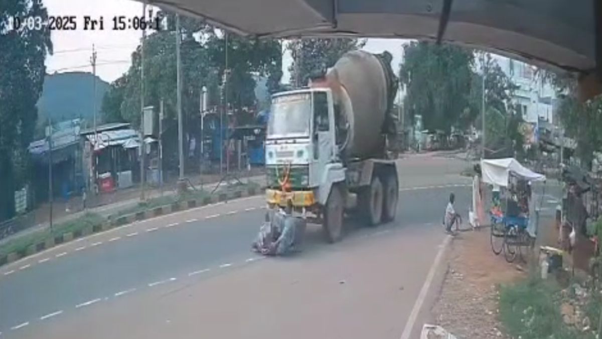 Video: Biker Loses Control And Disappears Under Cement Truck. He Survives