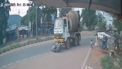 Video: Biker Loses Control And Disappears Under Cement Truck. He Survives