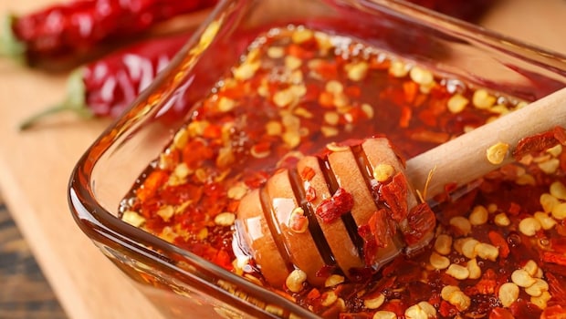 Why Everyone Is Drizzling Hot Honey On Pizza, Chicken, And Even Ice Cream