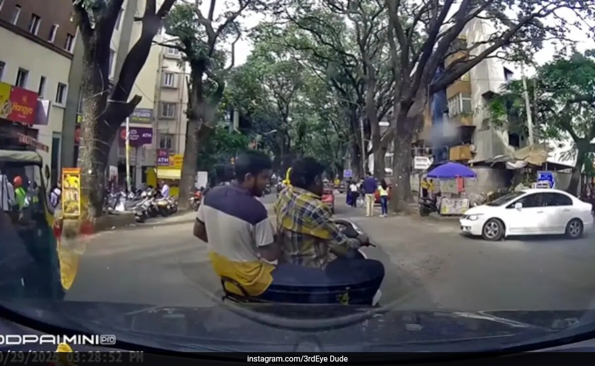Careless Biker on Phone Narrowly Escapes Crash in Bengaluru, Sparks Outrage